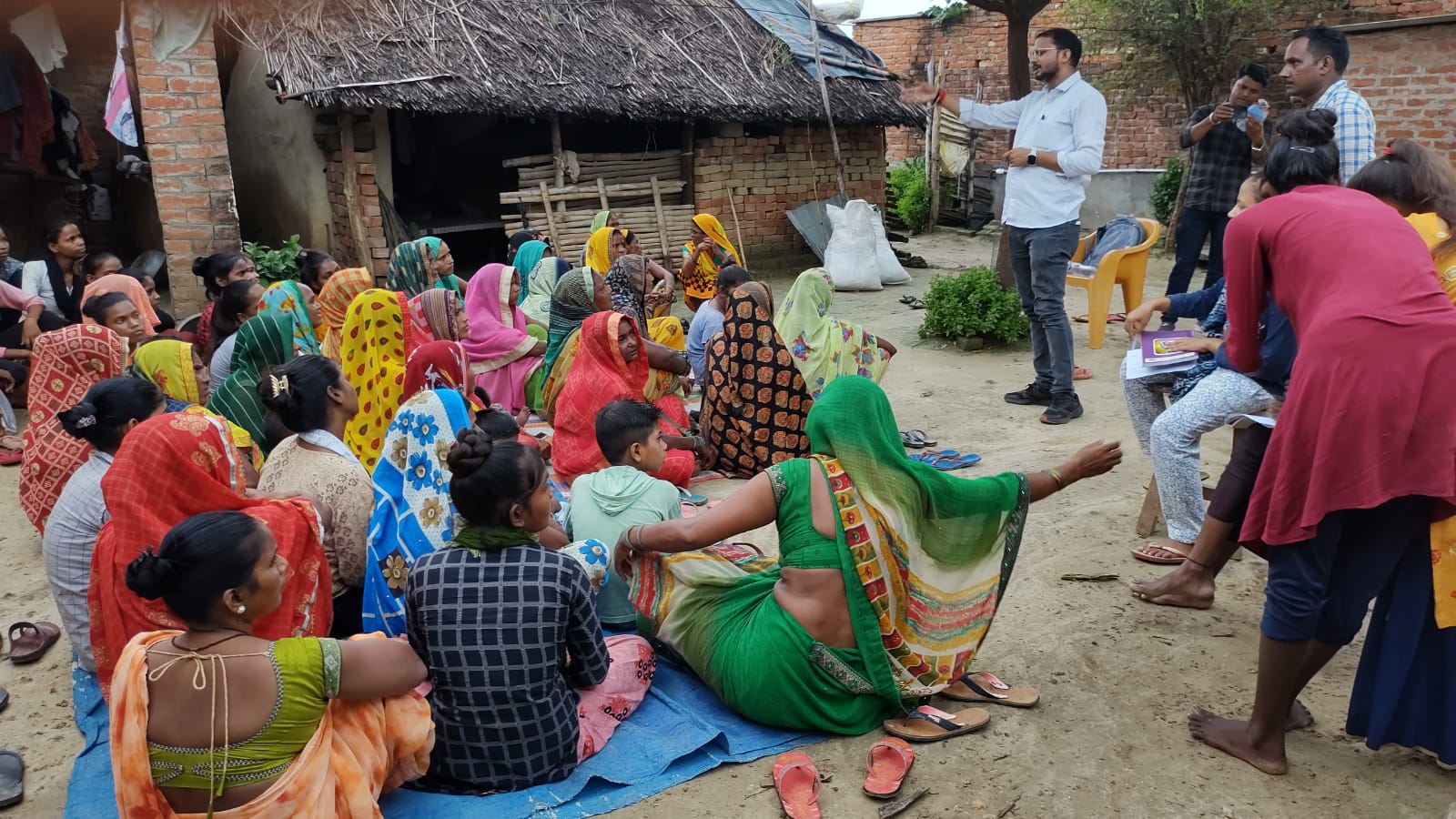 Women attending an outdoor community outreach session